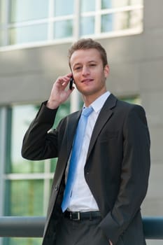 Young business man with a telephon
