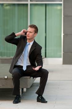 Young business man with a telephon