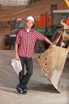 Architect working outdoors on a construction site