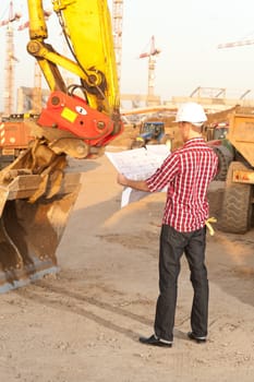 Architect working outdoors on a construction site
