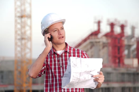 Architect working outdoors on a construction site