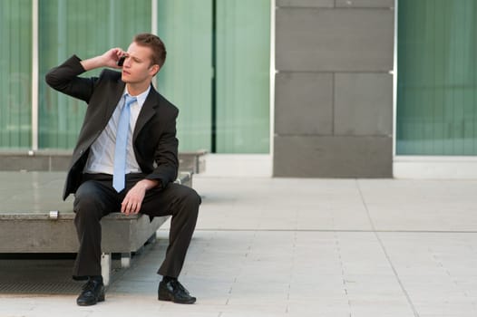 Young business man with a telephon