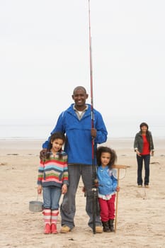 Family On Beach Fishing Trip