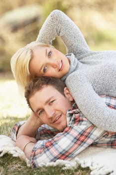 Portrait Of Romantic Young Lying On Grass