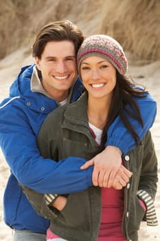 Romantic Young Couple On Winter Beach