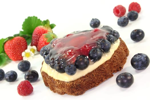 a forest fruit tartlet with various berries