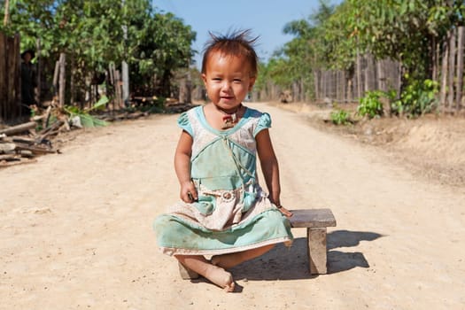 Portrait of asian child,with dirty face and poor clothes