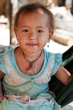 Portrait of asian child,with dirty face and poor clothes