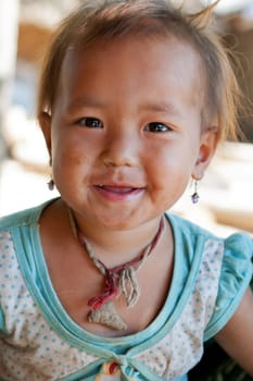 Portrait of asian child,with dirty face and poor clothes