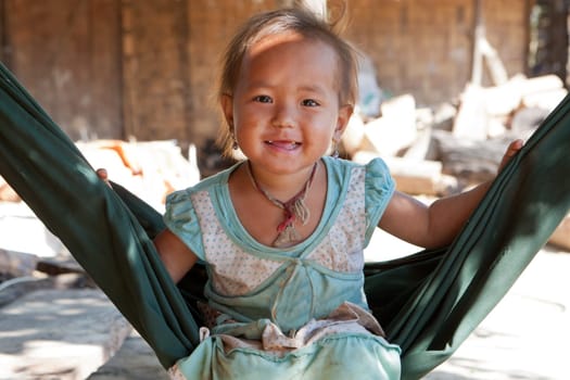 Portrait of asian child,with dirty face and poor clothes