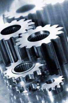 titanium gear wheels, aerospace industry, brushed aluminum background