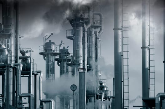 giant oil, gas and fuel industry, surrounded by dark storm clouds, vapours and fog