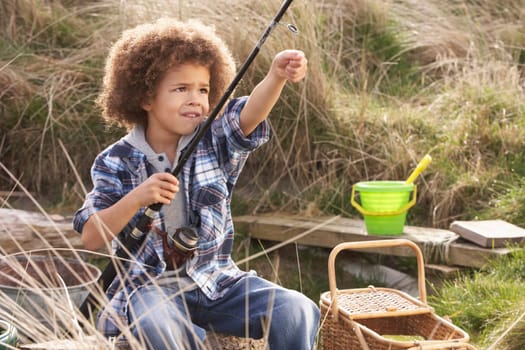 Young Boy Fishing At Seaside