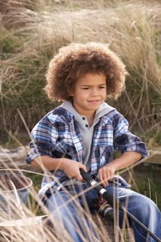 Young Boy Fishing At Seaside