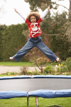Boy Playing On Trampoline