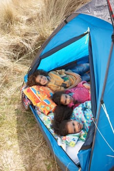 Children Having Fun Inside Tent On Camping Holiday