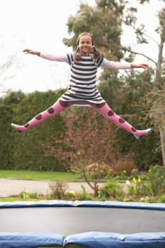 Girl Playing On Trampoline