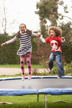 Children Playing On Trampoline