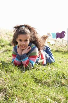 Young Girl Sitting Outside In Caravan Park