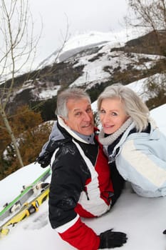 Senior couple having fun at ski resort