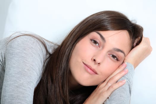 Closeup of young woman relaxing on sofa