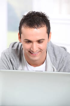 Young man using laptop computer