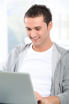 Young man using laptop computer