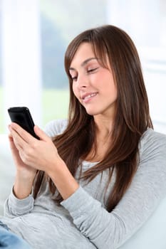 Beautiful young woman talking on mobile phone