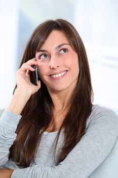 Beautiful young woman talking on mobile phone