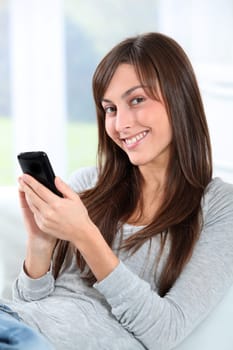 Beautiful young woman talking on mobile phone