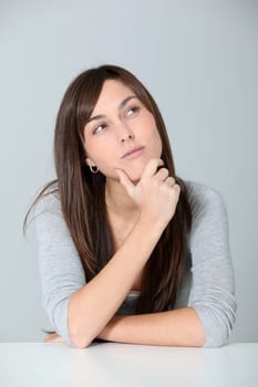 Closeup of young woman with doubtful look