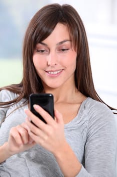 Beautiful young woman talking on mobile phone