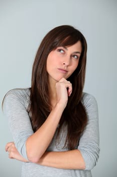 Closeup of young woman with doubtful look