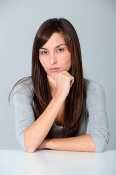 Closeup of young woman with doubtful look