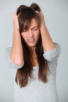 Young woman having migraine