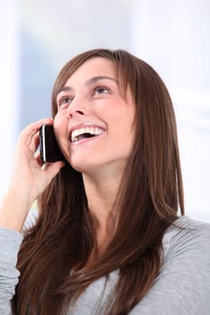 Beautiful young woman talking on mobile phone