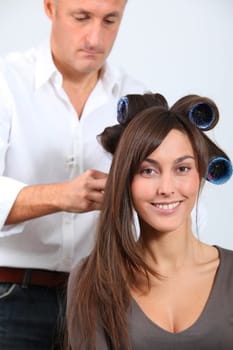 Woman getting hair-curlers