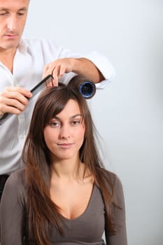 Woman getting hair-curlers