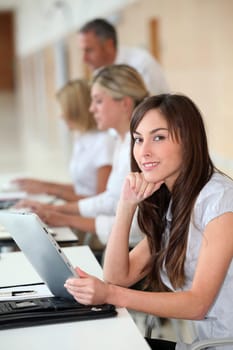Businesswoman working in the office on electronic pad