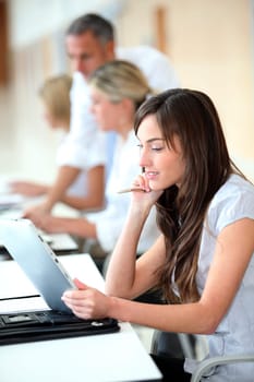 Businesswoman working in the office on electronic pad