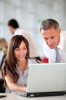 Manager and secretary working in the office