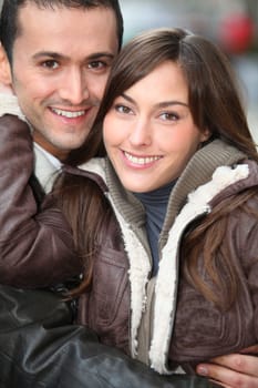 Young couple shopping in town in winter