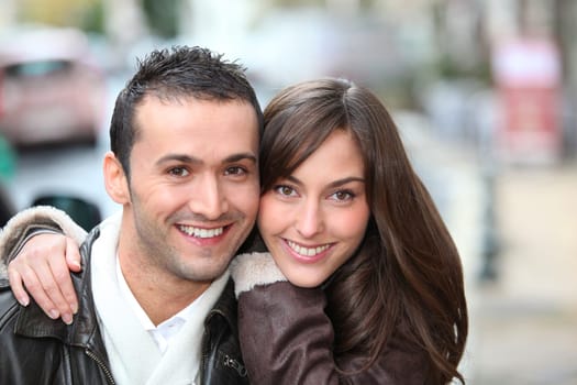 Young couple shopping in town in winter