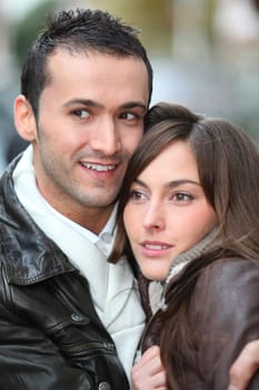 Young couple shopping in town in winter
