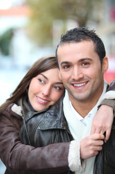 Young couple shopping in town in winter