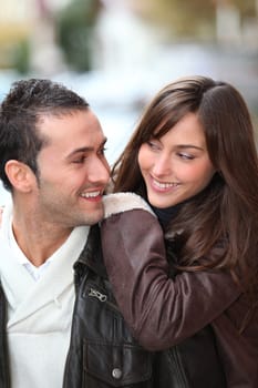 Young couple shopping in town in winter