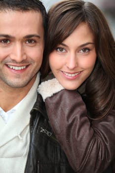 Young couple shopping in town in winter