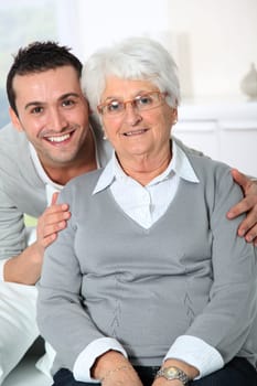 Closeup of elderly woman with young man