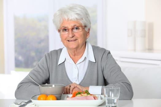 Old woman in nursing home ready to have dinner