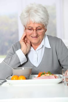 Old woman in nursing home ready to have dinner